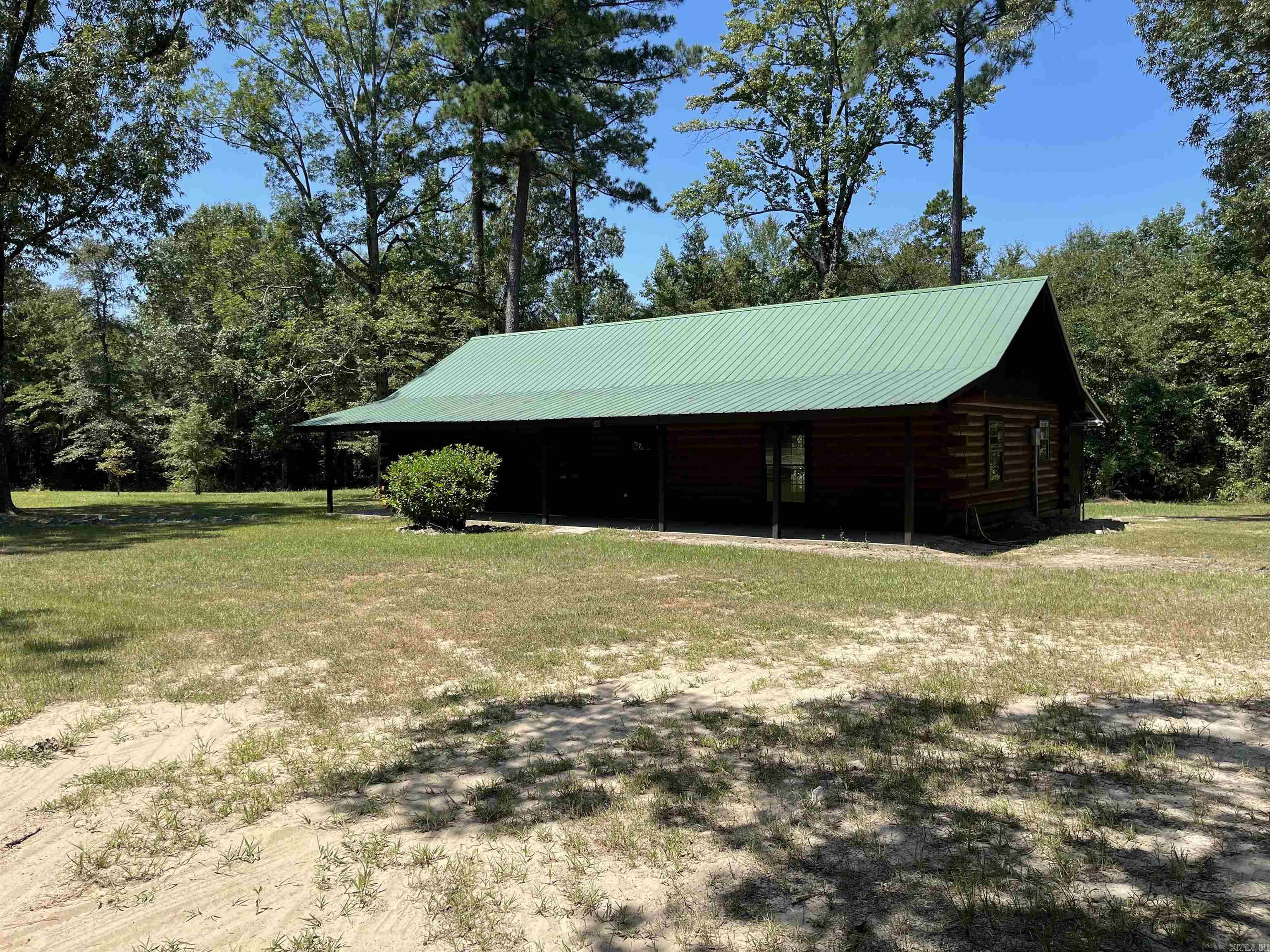 This home has been completely remodeled down to the log walls. New plumbing, new electrical, new paint, new dishwasher and stove, new HVAC, new ceiling fans. Everything inside is fresh and clean. A new laundry room was added as well as a new deck.