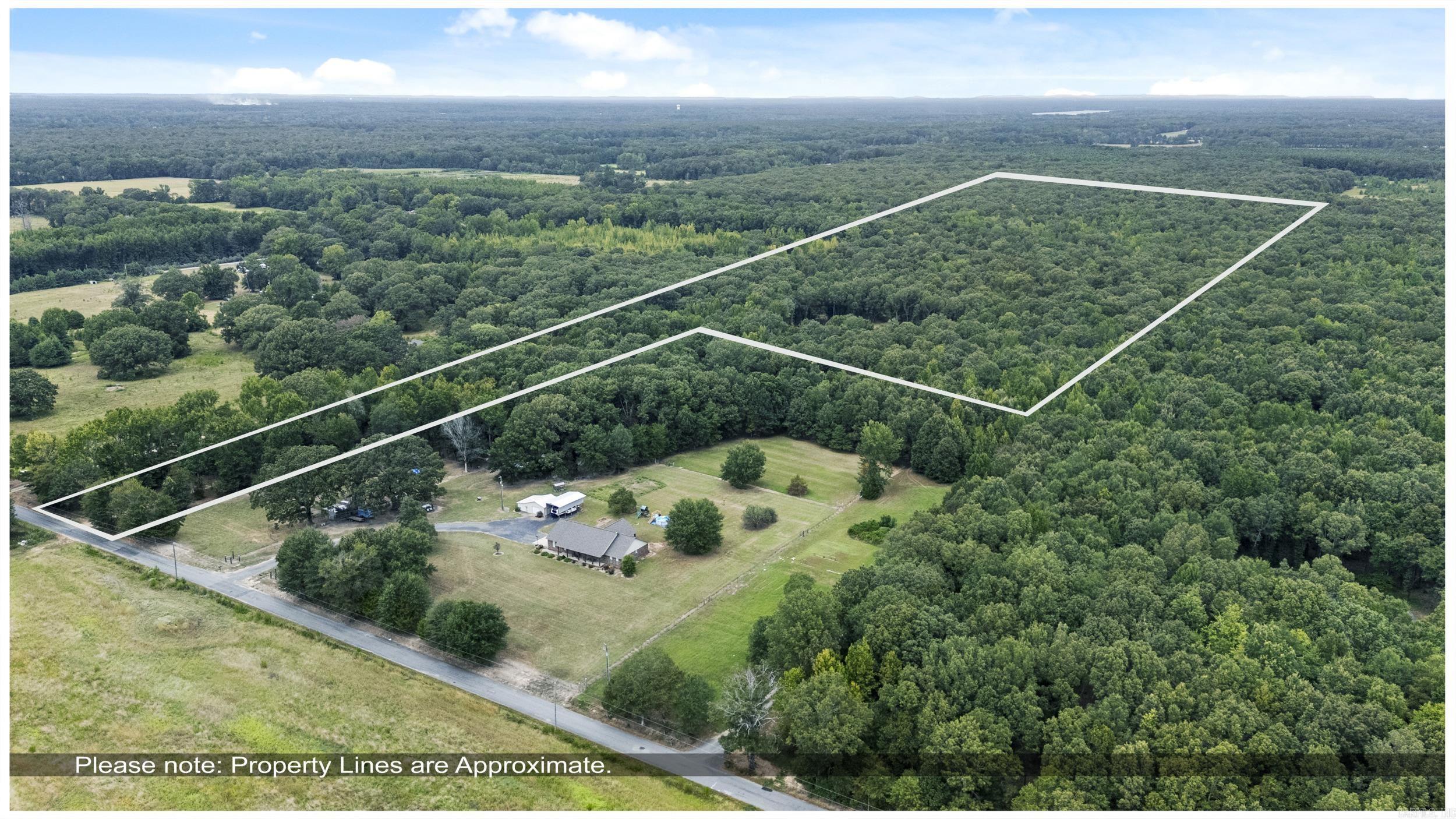 This beautiful 28.69 acre piece of land is located just east of highway 31 between Cabot and Lonoke. With a beautiful, long, winding driveway the property opens up to a cleared field of about 4 acres. There is a flatten area that is ready for you to build your dream home in the peaceful woods. Septic Tank is already in place. Also in this cleared area, there is a 30x40 shop that has a 300 sqft living quarters. This property has its own septic system. There is a cleared path through the property that can be used to access your private stocked pond. The mostly tree covered acreage is great for hunting.