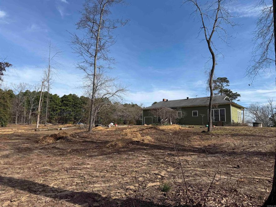 This amazing home site has so many memories and so much potential. The Old Hearn School sits on 8.8 acres.  For many years this was used as a home (2 Bedrooms, 1 Bath, Large Living Room)   This property could be so many things.  The owner is working on clearing the land. Could you convert the home to a restaurant? What about a restaurant and outdoor music venue? A RV Park? Or simply restore this home to a grand residence. With some TLC, this place could be exactly what you're looking for!