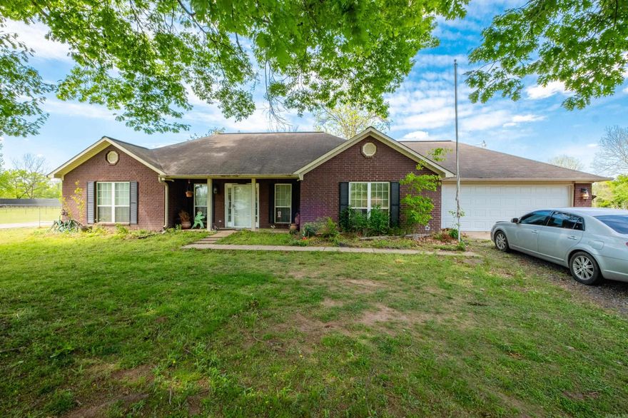 1 owner home sitting on 1/2 acre with a 30x30 workshop in the back with electricity. Home has 3 bedrooms and 2 baths, the primary is separate from the other 2 bedrooms. A large eat in kitchen area, a nice size laundry room with room for an extra fridge and extra storage also.  The old river is just across the road for great fishing and boating with beautiful sunrises and sunsets. Schedule your appointment today.