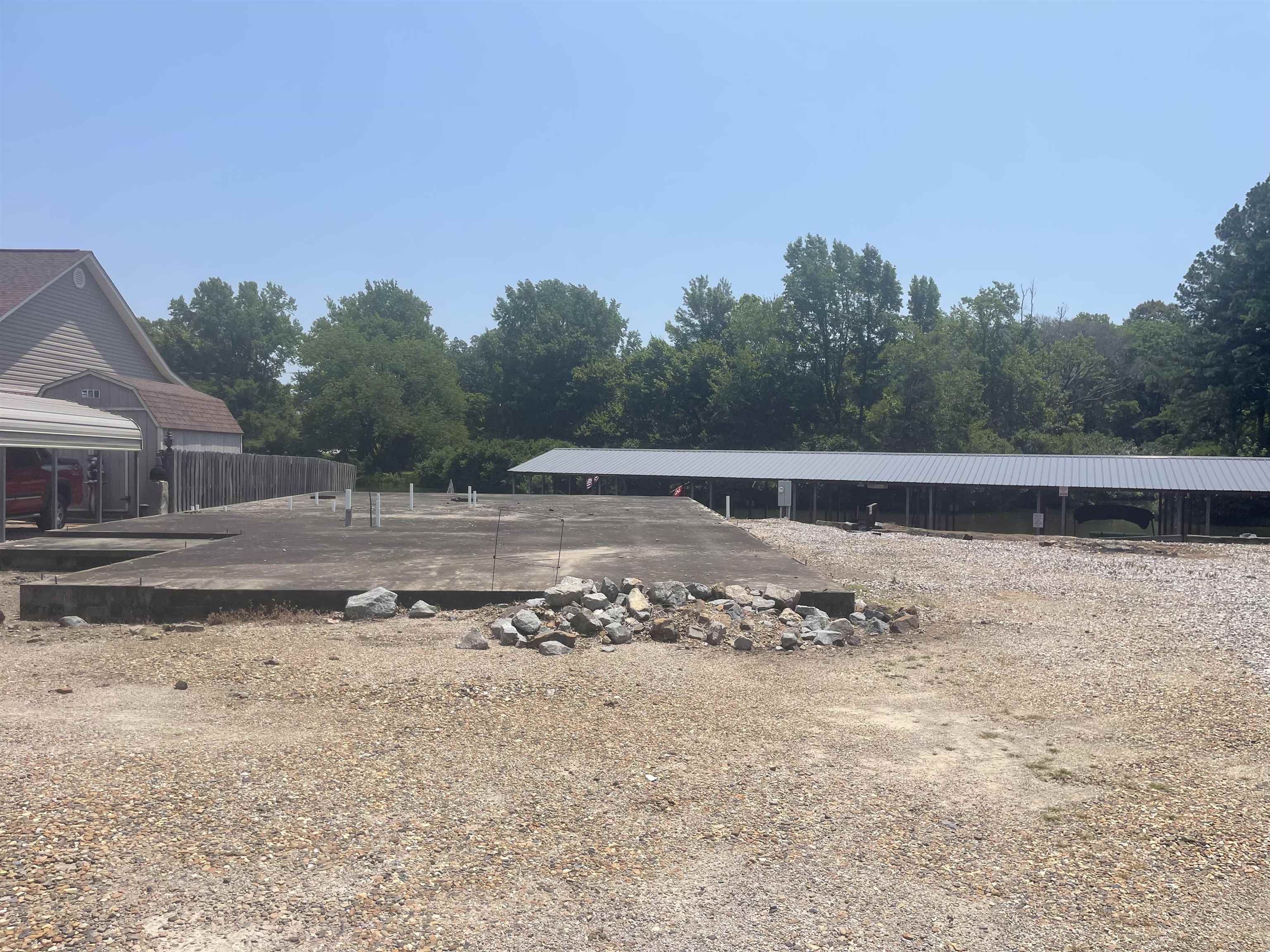 Vacant lot on Lake Hamilton. Slab already in place, would need to be evaluated to see if it is still viable. There are two boat stalls that would have to be purchased separately and would be required to purchase with the sale of this lot. The two stalls would be $10,000 each and sold outside of a real estate contract.