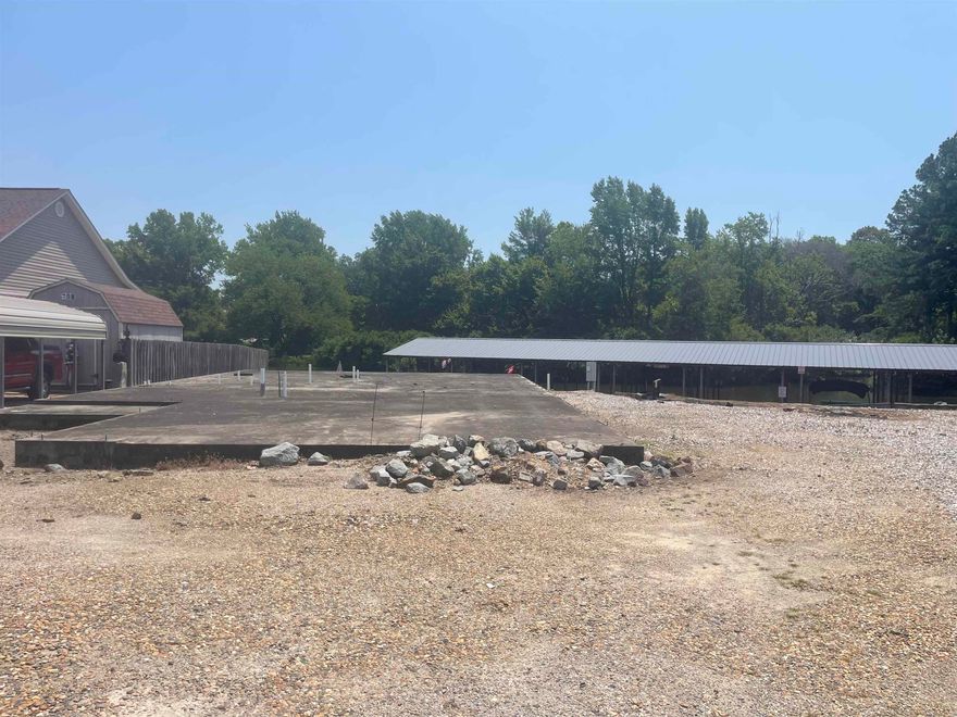 Vacant lot on Lake Hamilton. Slab already in place, would need to be evaluated to see if it is still viable. There are two boat stalls that would have to be purchased separately and would be required to purchase with the sale of this lot. The two stalls would be $10,000 each and sold outside of a real estate contract.
