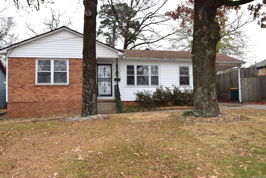 One family owned home since 1951 and just like good wine it just keeps getting better! Numerous updates and tender loving care can be found in this home. New carpet over old hardwood flooring has recently been added, as well a new hot water tank completed to code. One of the baths has been remodeled with a large vanity, reglazed tub and commode. There is plenty of closet space for storage throughout the home. The spacious lot is level and has beautiful mature trees and plants. Outside is a workshop and large storage building. Close to all the best shopping you could ever desire, not to mention St Vincent hospital and a myriad of medical specialty clinics. This would be a great starter home location for a Med student, nurse, or professional medical worker. An investor should have no problem finding a tenent to call this home as well!!