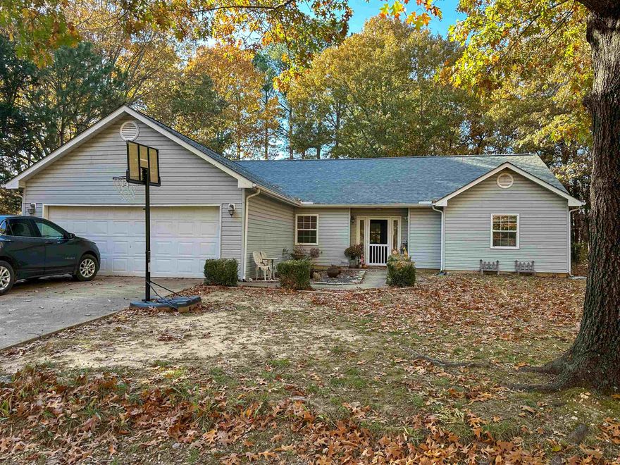A RARE FIND!    Built in 2000, this 3 bedroom, 2 bathroom home with a garage is situated on a nice and level yard within close proximity to the South Entrance of Cherokee Village.  Upon entry, you are greeted with beautiful vaulted ceilings, natural light, and a terrific split floor plan which allows privacy for the spacious master en suite.  Kitchen includes nice wood cabinetry, cheery breakfast nook, and a large pantry.   All appliances stay with the home!   Enjoy the outdoors from your covered back patio/deck area and allow your children or pets to roam the spacious backyard with fencing.  A house like this won’t last long.   Make an appointment to look at it today!