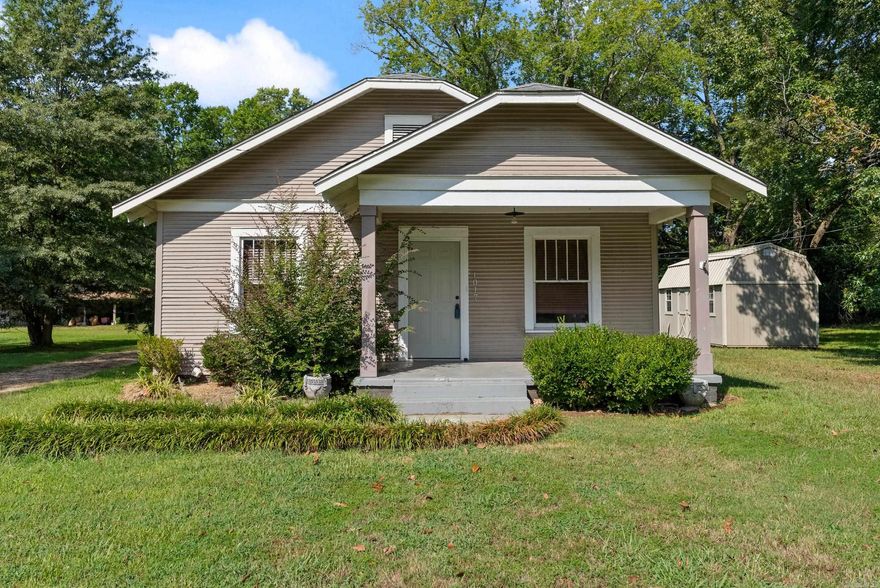 IN THE HEART OF CONWAY, YOU WILL FIND THIS CUTE HOME. A FRONT PORCH TO RELAX ON AND ENJOY THIS CHARMING AREA. A STORAGE BUILDING WITH ELECTRICITY, NEWER AC, LARGE LOT. JUST TAKE A LOOK AT THE POSSIBILITIES! SOLD AS IS