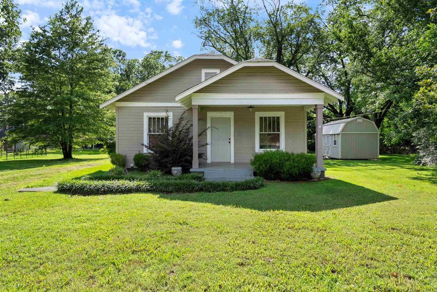 IN THE HEART OF CONWAY, YOU WILL FIND THIS CUTE HOME. A FRONT PORCH TO RELAX ON AND ENJOY THIS CHARMING AREA. A STORAGE BUILDING WITH ELECTRICITY, NEWER AC, LARGE LOT. JUST TAKE A LOOK AT THE POSSIBILITIES! SOLD AS IS