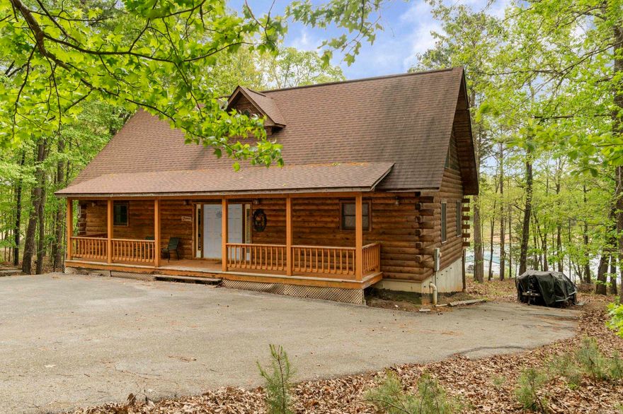 Experience the best of waterfront living in this spacious 3-bedroom, 3-bath lakefront home offering 2348 square feet of finished living space plus 1216 square feet of unfinished walkout basement ready for your vision. Comes with a private 2 boat slip, this property is ideal as a full-time residence, vacation home, or income-producing investment. The main level features an open-concept layout filled with natural light and highlighted by beautiful lake views. The kitchen flows seamlessly into the living and dining areas, creating an inviting space for entertaining family and friends.  The primary suite provides a relaxing retreat along with it's own bath, while two additional bedrooms each have full baths ensure comfort and privacy. The unfinished basement presents incredible potential, perfect for adding additional bedrooms, a media room, gym, or expanding living space to suit your needs. Step outside to a spacious deck overlooking the lake, ideal for morning coffee, sunset views, and outdoor entertaining. Enjoy direct access to boating, fishing and all the water activities. Make this excellent property yours, come and see for yourself.