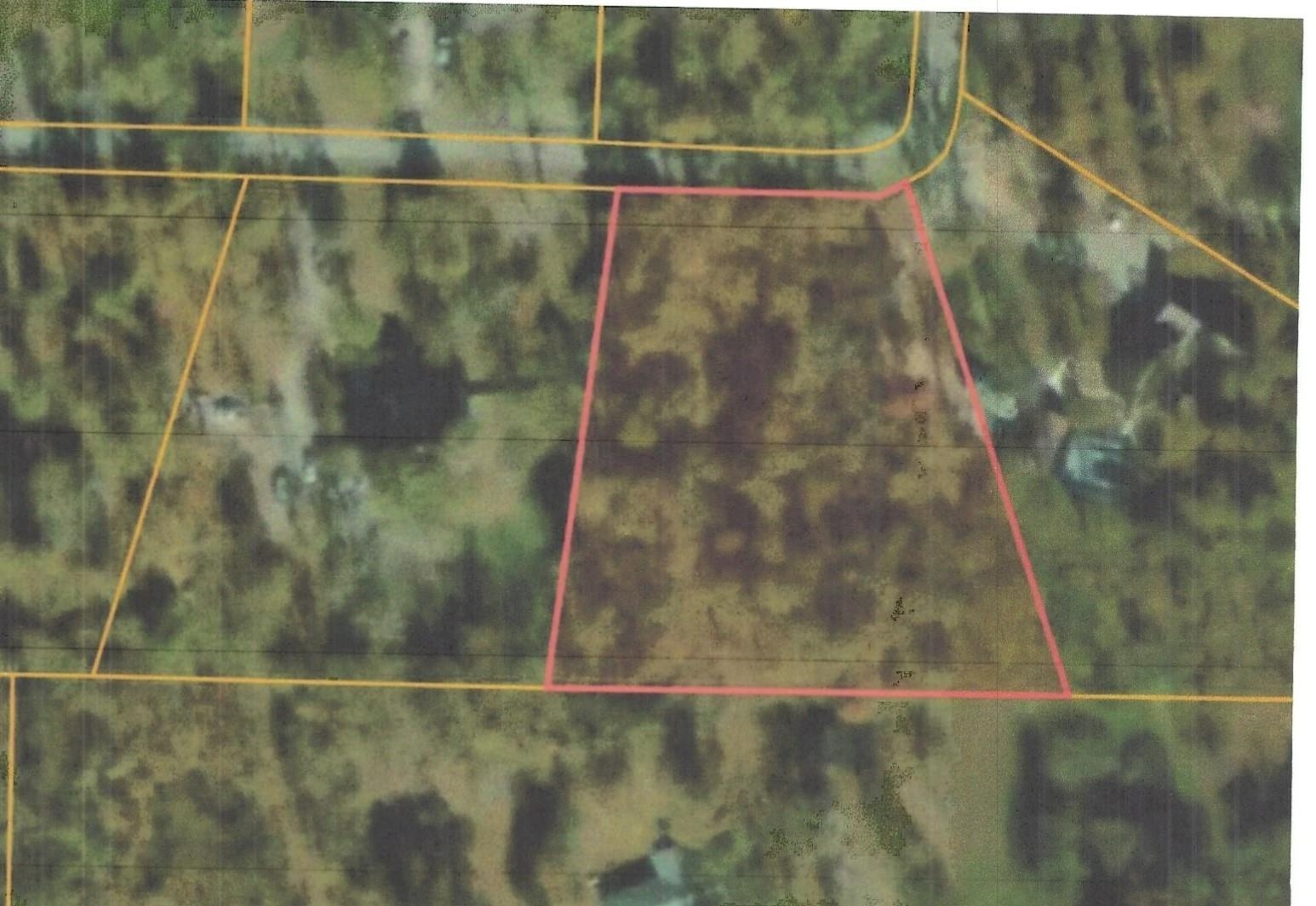 Wooded lot in Denmore Estates. Minutes to High School, medical and shopping. Centrally located in Highland. Great location for building.