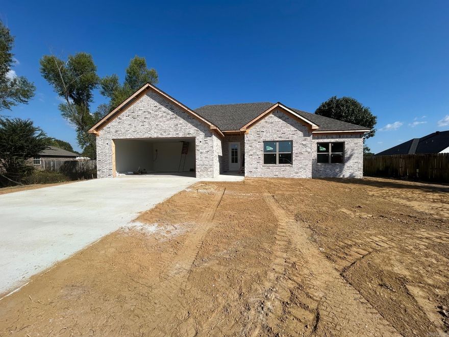 New Construction in Vilonia! This beautiful all-brick home offers a thoughtfully designed split floor plan and stylish, durable finishes throughout. Enjoy Coretec Luxury Vinyl Plank flooring throughout, quartz countertops, a modern electric fireplace, and Delta plumbing fixtures for a polished, high-quality touch. The primary suite features a spacious custom tile shower and a relaxing soaker tub, while all bedrooms offer comfort and flexibility. Built with energy-efficient features including high-performance windows, insulation, and HVAC to help lower utility costs. With an open layout, spacious garage, and plenty of natural light, this home combines comfort, efficiency, and style — plus a huge, fully fenced backyard perfect for outdoor living in a desirable Vilonia neighborhood.