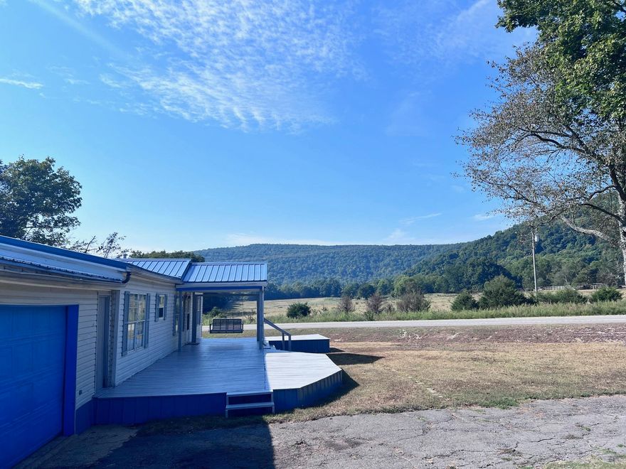 New Price Alert! The seller is now offering an additional $2,500 towards buying down the interest rate for qualified buyers, secure a beautiful home with lower monthly payments. Just minutes from Mountain View, AR, this well-maintained 3-bedroom, 2-bathroom manufactured home offers stunning mountain views and convenient access to all local amenities. The home features a recently installed new roof (2021), an upgraded electrical system, and a spacious 16'x40' shop, perfect for storing your toys. Additional 12'x12' storage building out back, along with a 20'x28' attached garage. The new deck out front is perfect  for ejoying your morning coffee or soaking in stunning sunsets over the mountains. Inside, you'll find new flooring in the living and dining rooms, as well as a recently installed Minisplit system that ensures efficient heating and cooling throughout the year. All appliances, including the washer and dryer, will convey with the home, making this a turnkey opportunity. This property is priced to sell and offers an incredible opportunity for those seeking a home with exceptional value. Don't miss out on this chance to own a piece of Mountain View at an unbeatable price!