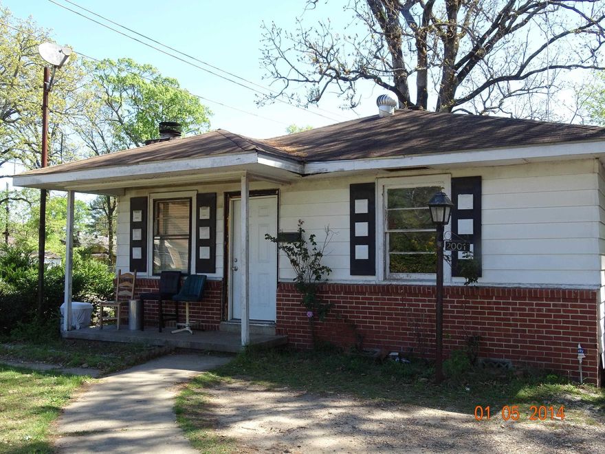 check this out!! This home is on a corner fenced lot.  It features a large living/dining room area with a fireplace.  Tenant occupied.  Need 24 hour notice.  Sold as is.