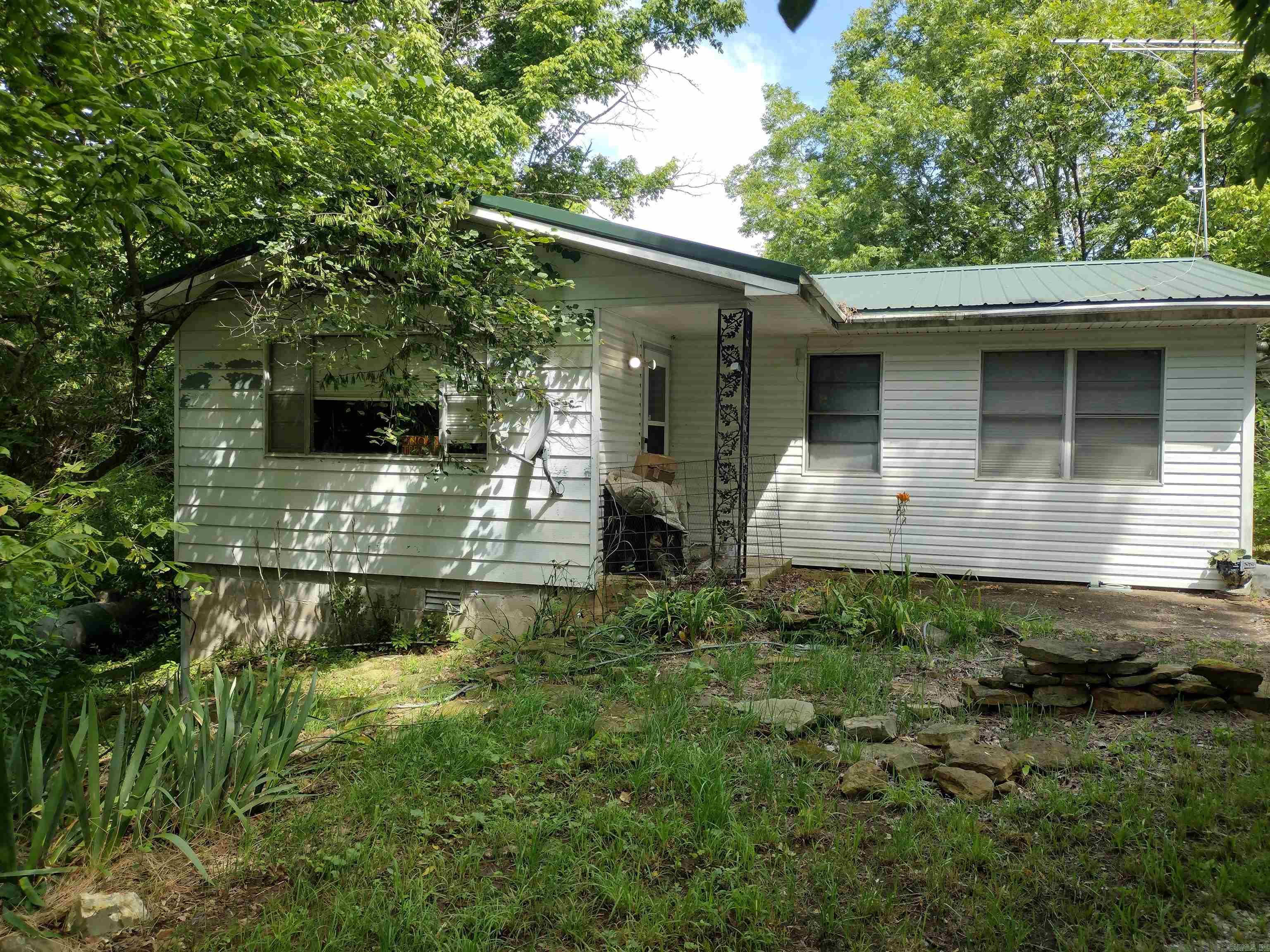 Nice home set back in woods shed and old chicken coop for your hobby farm very neat property with Timbo creek and has pond on property