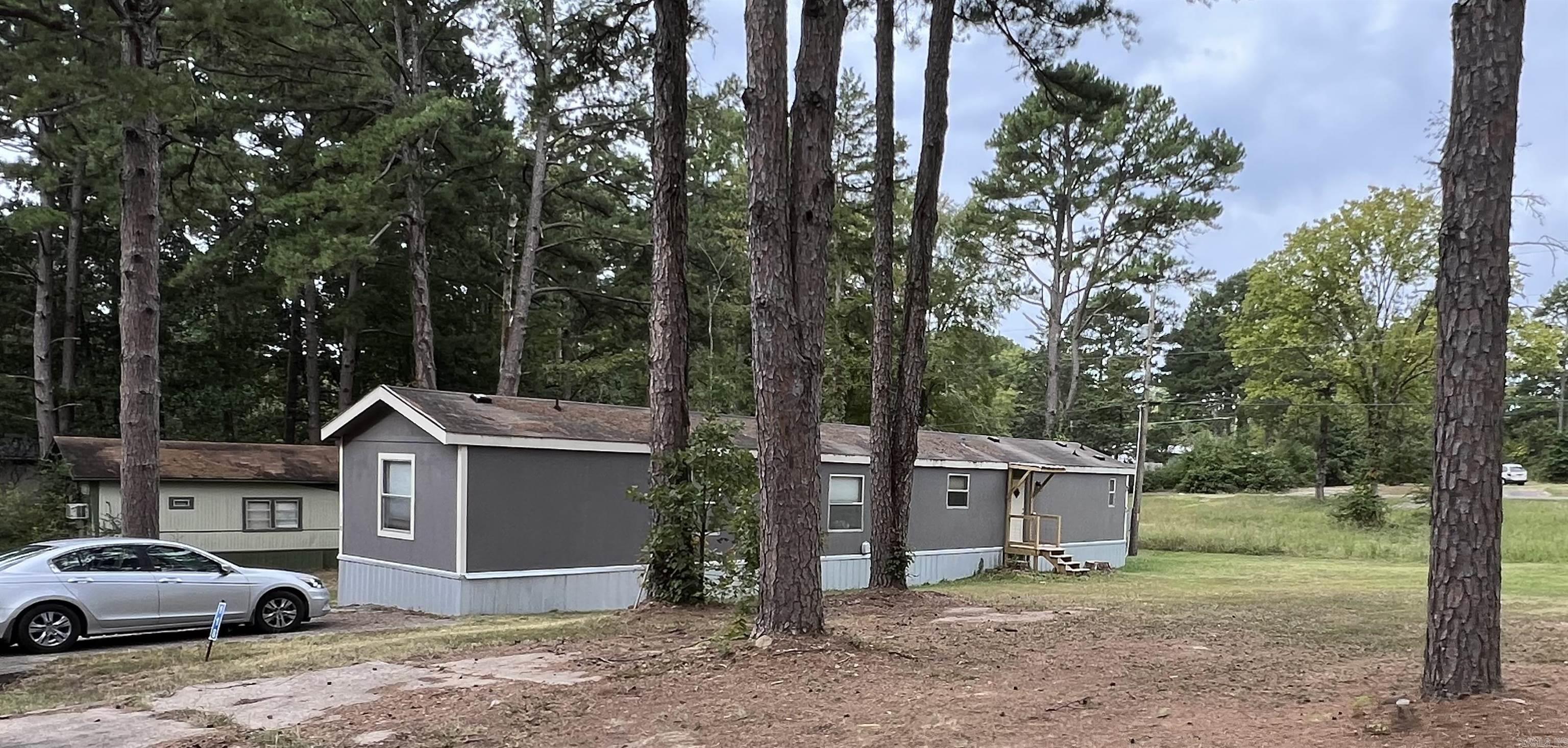 This manufactured home has undergone a major renovation in the past year. Large open kitchen and living room. New appliances; new soaker tub in master bath. Two new decks at front and back doors; new sewer lines. This home is move in ready!