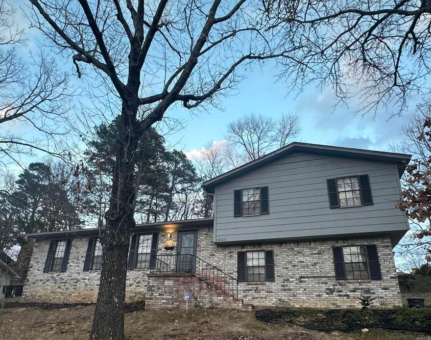 Beautiful home tucked away in a wooded neighborhood. Huge Backyard! Updates throughout. Gorgeous wood floors. The home has a fantastic screened in back porch and patio. The garage is over-sized and has ample storage. Two living areas plus a dining room. Granite counter-tops and new appliances with a massive pantry. The fireplace in the den creates a cozy atmosphere. Agents see remarks.