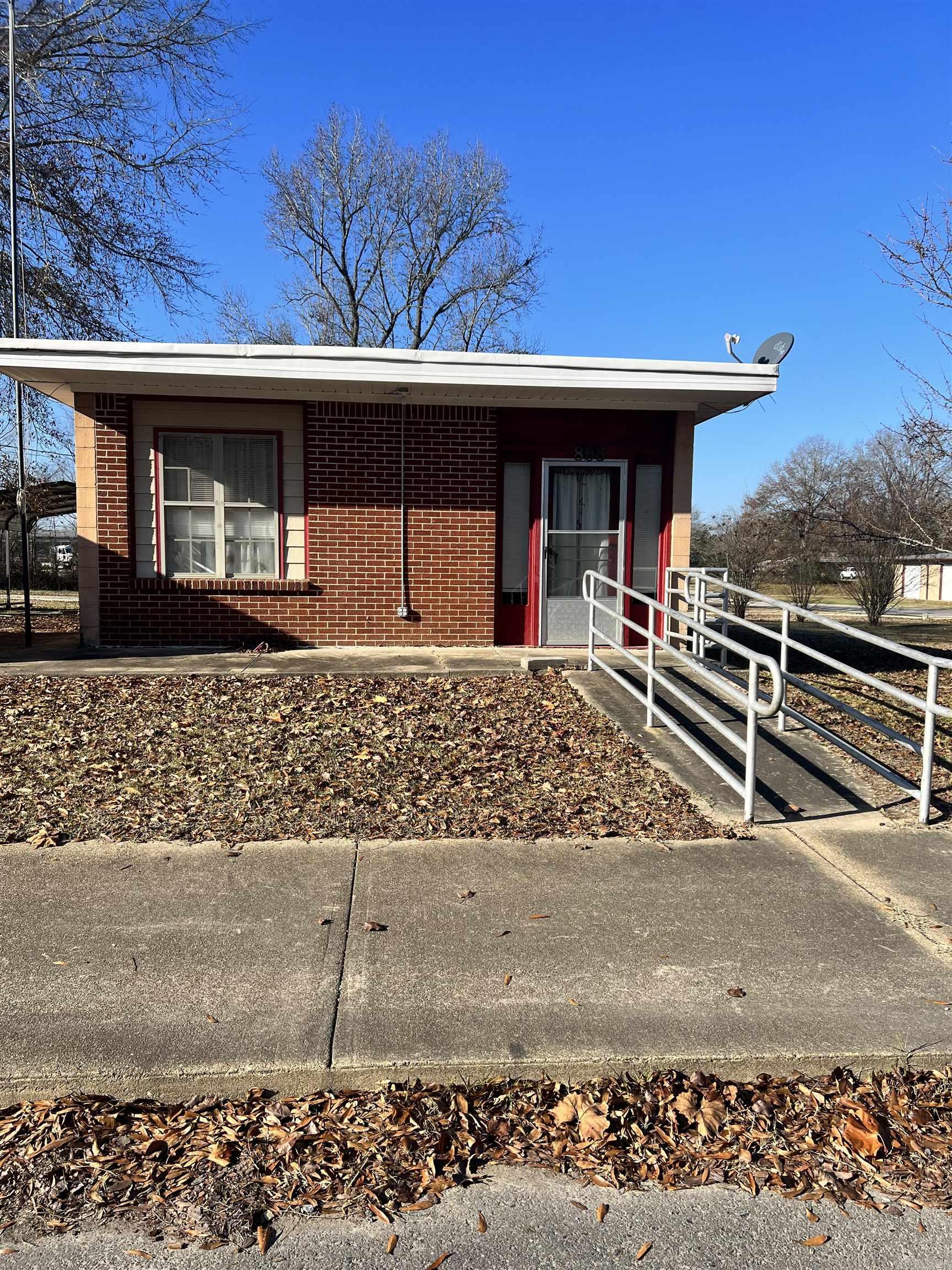 Wonderful Investment opportunity! This old post office has been remodeled into a single family home. This property sits on 7 city lots with two additional lots on either side. Carport and shed to convey. Courthouse records show this as commercial, so cash or conventional financing only.