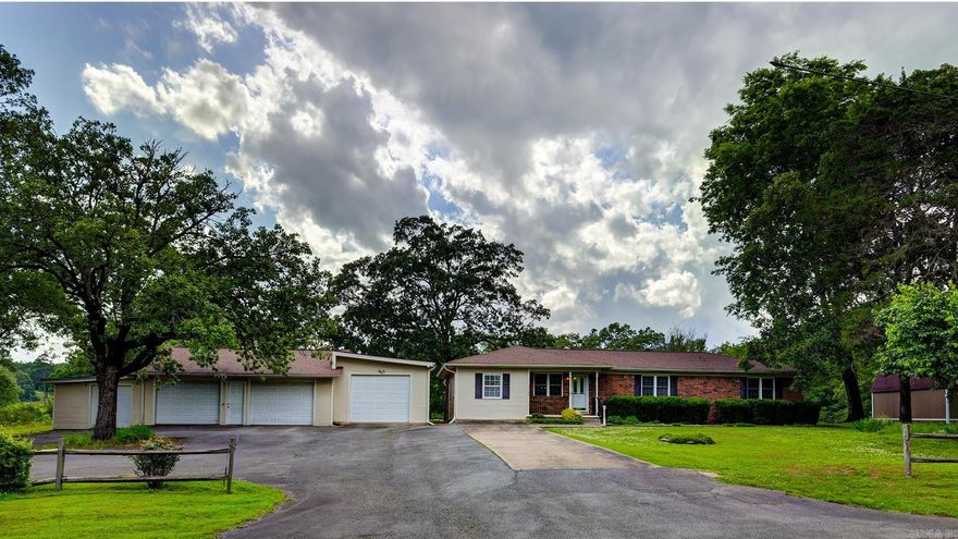 Adorable 3bed 2bath house on 3.02+/- Acres with large detached heated and cooled 3car workshop/garage, outside 20'x10' storage shed with electricity and covered RV/Boat Storage Barn 32' long, 17' wide 16' tall with 30 amp hookup. The kitchen was remodeled in 2021 with new appliances and quartz countertops. Both bathrooms have been updated with quartz countertops. All bedrooms and living room feature original hardwood floors. Off the back of the house you will find a huge bonus room with tons of natural light. This home also features a bonus room that would make a great office or craft room. The property backs up to a year round creek that the Sellers have never seen out of its banks in the over 14 years they have lived there. Check this house out before it's gone!