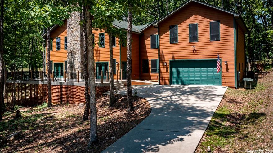 Situated on Indian Hills Golf Course. Very open living dining area, w/ beautiful stone fireplace. Great kitchen to entertain guest. Main level has master bed & bath.  Upstairs has 4 bedrooms & 3 baths.  (One bedroom is being used as a craft room.  Nice 24'X36' garage for your cars & your toys. There is a safe room under the deck. This home is low maintenance w/James Hardy cement siding (25 year paint warranty), & composite decking.  Some furniture could be purchased. Just 10 min to Greers Ferry Lake.