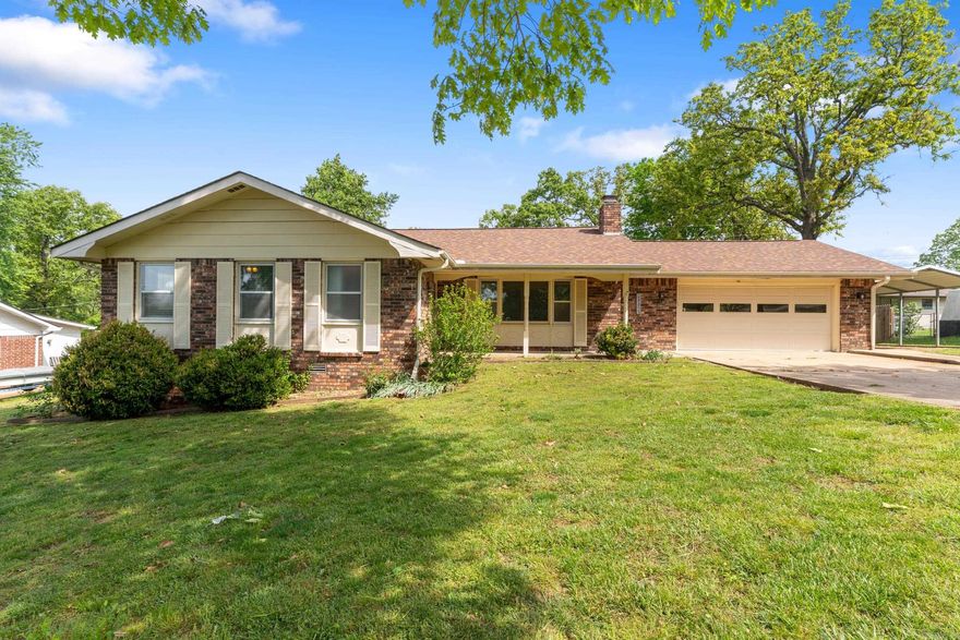 Beautifully updated all-brick home in the desirable High Chaparral Subdivision! This 3 bedroom, 2 bathroom home offers 1,461 square feet of comfortable living space and a 2-car attached garage. Inside, you’ll love the rich 3/4” solid wood floors and cozy woodburning fireplace that add warmth and character. Enjoy relaxing mornings on the covered front porch and entertaining in the fenced backyard, complete with a 10x12 storage shed (2021).  Fully remodeled in 2020, this home includes updated appliances—washer, dryer, microwave, dishwasher, refrigerator, and stove—all replaced that year, along with a new fence. Additional upgrades include a carport added in 2022, new HVAC system and septic pipe update in 2024, plus a brand-new roof and gutters in 2025.  Move-in ready with thoughtful updates throughout, this home offers comfort, functionality, and lasting value in a sought-after neighborhood! Buyer to verify all measurements and square footage.