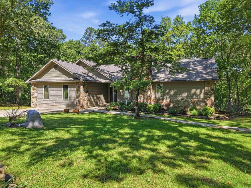 Tucked away in the natural beauty of Fairfield Bay, this charming home offers the perfect escape for those seeking peace, recreation, & a true connection to the outdoors. Located directly across the street from Mountain Ranch Golf Course & less than 10 minutes from the sparkling waters of Greers Ferry Lake, you’ll enjoy the best of resort-style living right at your doorstep. Situated on 3 wooded lots, the property provides an incredible sense of space & privacy, surrounded by mature trees & beautifully landscaped grounds that create a warm & inviting setting year-round. Inside & out, this home has been lovingly maintained with thoughtful updates including newer appliances, a roof replaced in 2021, and one new HVAC unit for added comfort & peace of mind. The fenced backyard is ideal for pets, family gatherings, or simply relaxing in your own private retreat. Spend mornings sipping coffee on the screened deck while listening to nature, or unwind in the evenings on the lower deck after a day on the lake or golf course. Fairfield Bay is known for its endless outdoor adventures including ATV/UTV trails, hiking and biking trails, pickleball courts, and two beautiful 18-hole golf courses.
