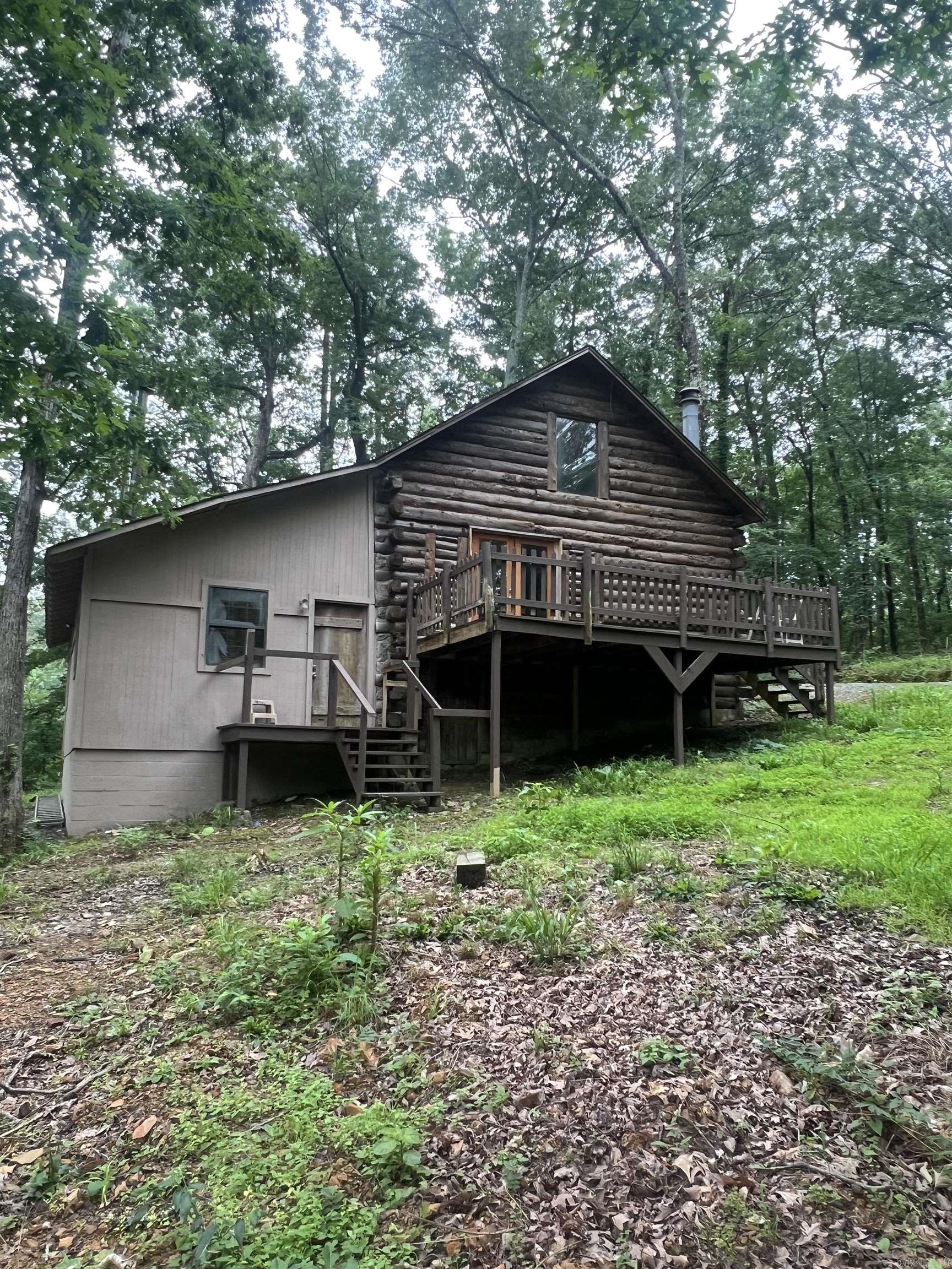Turnkey cash flowing log cabin duplex on prime West Little Rock lot. This duplex is a one bedroom, one bath studio on South side and two bedroom two bath on the North side. The studio rents for $850/m and 2b rents for $1000/m. Property is currently leased. Both leases are month to month and both tenants have occupied property for about two years. Both tenants have excellent payment history and keep the property in excellent condition. Home to be sold as-is, agents, see remarks.