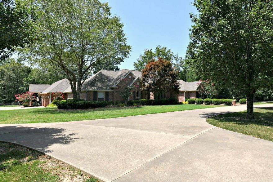 Live, Work, and Play in the Heart of Nature! Welcome to your dream retreat nestled against the Ouachita National Forest, just minutes from the proposed mountain bike trails and the stunning Talimena Scenic Drive! Whether you're looking for a full-time residence, investment property, or vacation escape – this one-of-a-kind estate has it all. Main Home – Spacious & Stunning. 4 Bedrooms | 3 Bathrooms | Over 3,400 sq. ft. Brick construction with large open rooms, walk-in closets, and a split floor plan. Attached 1 Bed / 1 Bath guest quarters – perfect for guests or rental income. Gorgeous pool, large patio, and 3-car carport/breezeway. Peace of mind with a 22 KW whole-house generator.  Barn dominium – Style Meets Function: 40' x 72' steel structure with full living quarters: Living room, 1 Bedroom, 1 Bath, kitchen, laundry hookups. 3 bays: motorhome + boat parking, workshop (550 sq. ft. with mini split HVAC), truck bay. Overhead doors, overhead storage, and a covered patio. Full RV hookup and ample parking – perfect for guests or short-term rentals. Land & Location: Over 4+ acres  directly adjoining the National Forest. Hiking, biking, and scenic drives right outside your front door!