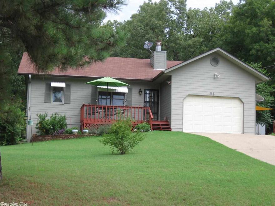 BEAUTIFULLY MAINTAINED home built in 1997 is very energy efficient, has open floorplan, gas log fireplace in living room, nice kitchen/dining area, appliances included, master bedroom has french doors that open onto enclosed deck with hot tub, front deck, rear patio and attached 1 car garage. Extra parking pad and storage building are included on adjoining lot.