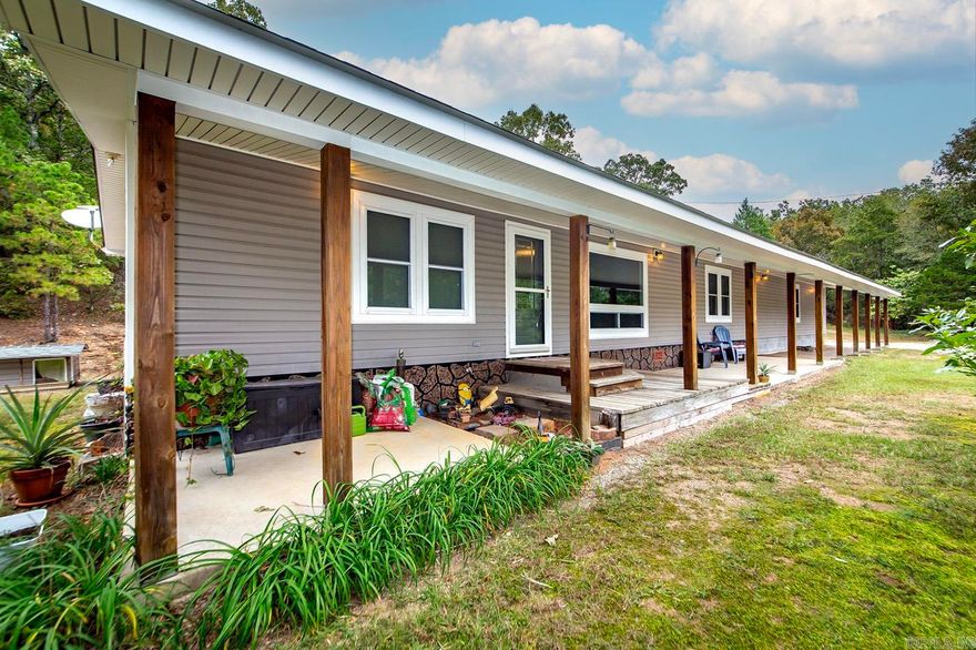 Welcome to a peaceful country setting just outside Norman with beautiful views and privacy. This charming home sits on 10 acres with a long private drive off Highway 8 East, offering a quiet retreat surrounded by nature. Updates include a newer architectural shingle roof, insulated vinyl siding, and energy-efficient double-pane windows for comfort and durability. The inviting full-length front porch is perfect for relaxing and enjoying the scenery. Utilities include natural gas, rural water, fiber-optic internet, and electric. A great bonus feature is an additional unfinished area of approximately 308 square feet with a cinder block foundation—ready to be finished out for extra living space, a studio, or workshop. Conveniently located near the Caddo River, Lake Ouachita, and Ouachita National Forest, this property combines country living with easy access to outdoor recreation. Come experience the peace and potential this property offers!