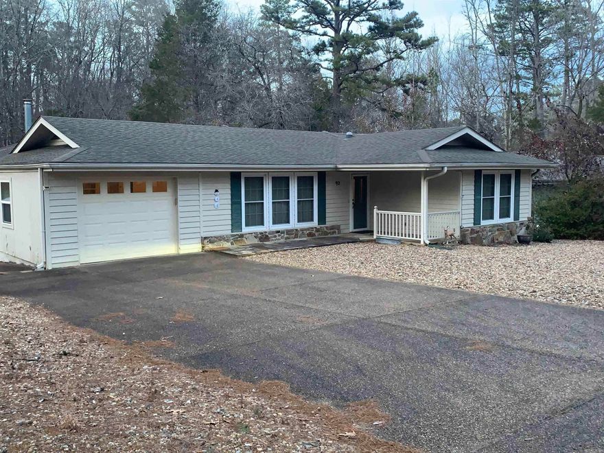 Welcome to this charming two bedroom, two bath home in Hot Springs Village. This homes offers skylights throughout the home providing plenty of natural light, creating a warm and inviting atmosphere. This cozy gem provides a lovely sunroom perfect for relaxing and entertaining. There is a safe room for added security and peace of mind as well. The outdoor space has a covered porch, completed with a Generac with backup propane. The home is handicap accessible for convenience, the custom wood office work in bedroom adds a unique touch to the home. There is plenty of parking in the front. Inside, you'll find plenty storage space, including an extra storage room and the garage features attic access, providing additional storage space. Located in a quiet neighborhood with great neighbors, this home is the perfect place to relax and unwind. Come see today!