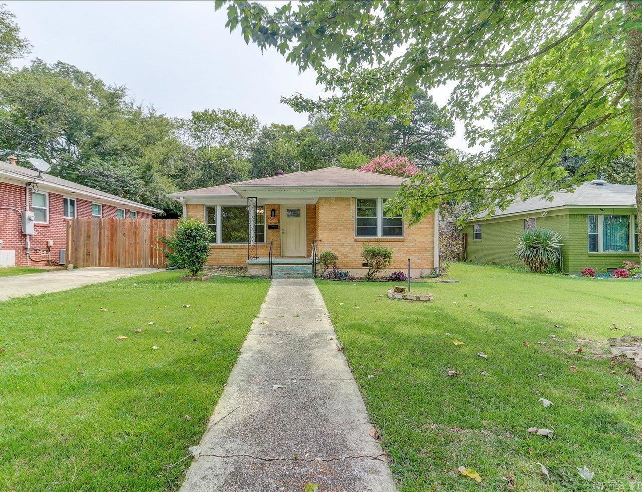 Charming updated cottage on a level lot with new landscaping. Meticulous care has been taken to update this home, which features beautiful hardwood floors, arched doorway, an eat-in kitchen, and a breakfast bar with a chopping block top, along with an updated kitchen and laundry room. The cottage includes two oversized bedrooms with closets and a newly updated bathroom. This home is light, bright, and move-in ready. The outdoor space boasts an oversized covered patio, a fenced yard, a long two-car carport, a spacious backyard, a storage building, and a terraced raised garden area. The neighborhood is conveniently located near shopping, restaurants, and services while still being quiet and clean. Come see this lovely home today!.