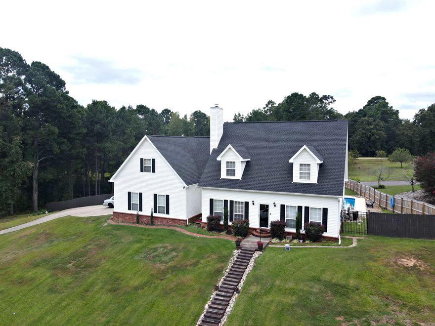 Welcome to this tranquil oasis in the middle of town. Large acre lot includes a very spacious privacy fenced in back/side yard that has all the wildlife needed to enjoy country living in town. Plus a fabulous outdoor entertaining area with an inground pool just waiting for that family/friends gathering to enjoy. Step inside to large spaces for entertaining, family gatherings or just indulging at home which can be done in this wonderful large master suite. Upstairs has so many options for spreading out with bonus spaces that can be used for a game room, office spaces or large closest space. Then don't forget an incredible 3 car garage. Come check out this home that could be your DREAM HOME. Roof and Pool placed in 2021. Hot Water Heater is 4 years old. HVAC 1998 serviced 2X yearly. Refrigerator does NOT convey.