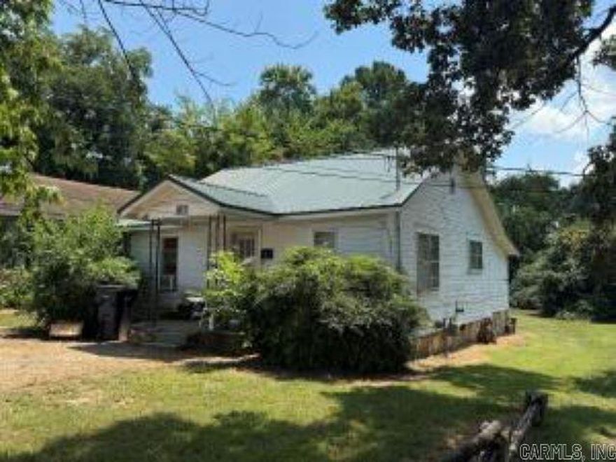 EXCELLENT LEVEL, CORNER LOCATION FOR FUTURE COMMERCIAL DEVELOPMENT. 6 RENTAL UNITS & 2 vacant lots on Lawrence and 15th Street located East just behind Flowers Bakery & beside the Arkansas Heart Hospital Clinic near White River Medical Center. Current total monthly income $2675. 1460 Lawrence Street is 2BR/1BA monthly rental income $425 due to having a 10 year tenant.1470 Lawrence Street is a 3BR/1BA house rental income $750 per month. One large unit split into apartments is: 1496 Lawrence Street is 2BR/1BA monthly rental income $500 per month. 1300A 15th Street is 2BR/1BA monthly rental income $350. 1300B 15th Street studio apt monthly rental income $300. 1302 15th Street is a 1BR/1BA monthly rental income $350.  Owner pays water & provides lawn care on large unit. See agent remarks.