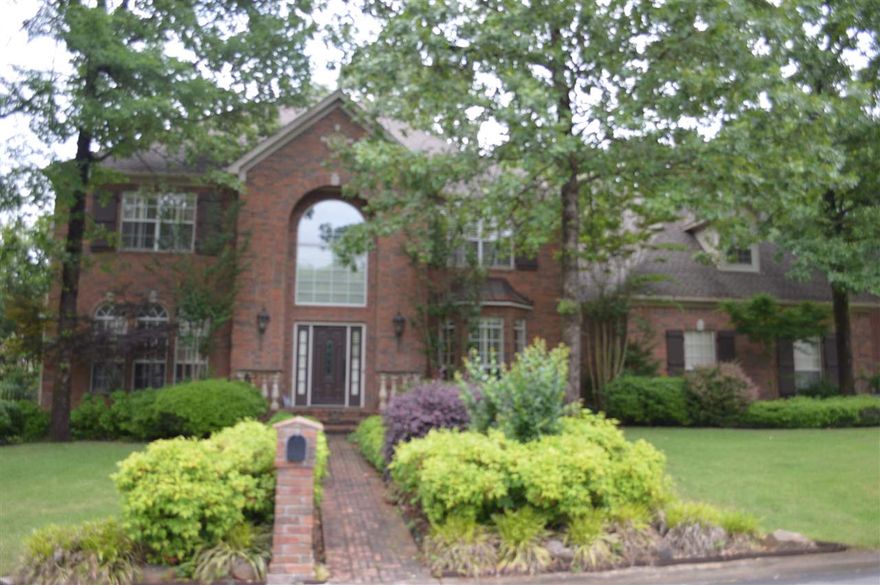 Stunning home located in a family friendly neighborhood with mature trees.  This custom home offers beautiful hardwood floors, exquisite moldings and custom trim throughout the home, an abundance of windows creating a light and airy feel, a great room for large gatherings, formal dining room, downstairs office with gorgeous built-ins and a hearth room for the family.  The upstairs includes three bedrooms, two bathrooms and a nice sized bonus room with a separate room for an office or study. Call today!