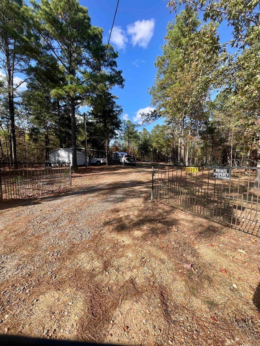 Partially cleared homesite offering a mix of open space and wooded privacy, with established trails leading to prime hunting areas. This 9.149-acre property sits just 2 miles east of Doddridge along Highway 160, providing easy access and a convenient location. Property features include a deep well, septic system, and a workshop/storage building equipped with an air conditioning unit and an attached carport. A small open shed adds additional storage options. This tract is well-suited for a homesite, weekend getaway, or recreational retreat.