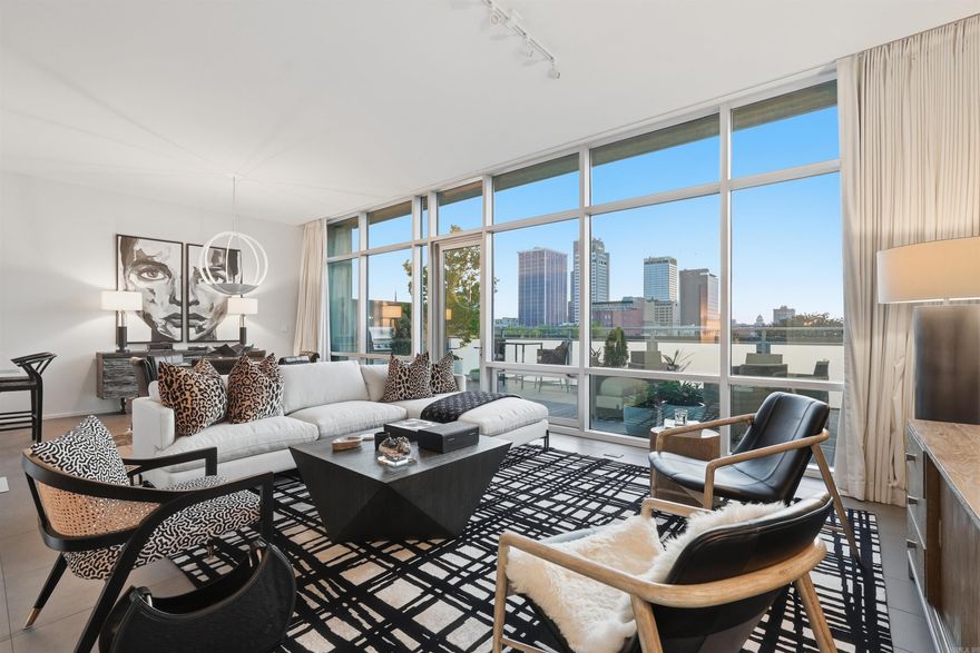 Welcome to this professionally designed 2-bedroom residence offering a blend of sophistication, skyline views, & easy downtown living. Floor-to-ceiling windows bring in incredible natural light and showcase the Little Rock skyline. One of the standout features of this home is the oversized private balcony, a rare offering in the building. It’s fully equipped with a built-in grill, firepit, integrated lighting, and automated irrigation, making it the perfect place for sunsets, cookouts, or simply unwinding above the city. Inside, the open layout feels refined and inviting. One of the bedrooms has been converted into a stylish office/study with double glass doors and can easily function as a guest room when needed. Residents of 300 Third enjoy concierge services, fitness center, swimming pool, a party room, and secure parking. This unit includes two designated parking spaces in the private deck. With the River Market, dining, shopping, and cultural spots just steps away, the lifestyle here is walkable, connected, and convenient. Optional on-site storage is available. Opportunities like this are uncommon, experience the best of downtown living in a residence that truly rises above.