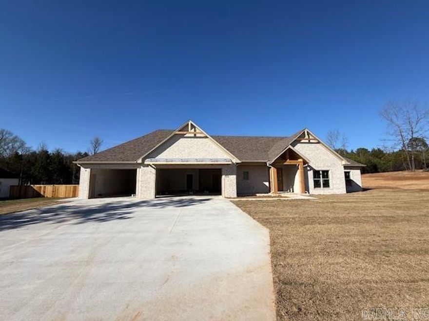 This home is located in a brand new subdivision in Greenbrier. It has a very large backyard with trees to buffer the view of the neighboring homes. The large back porch is great for entertaining. Inside the home you will find high ceilings and large windows. The sliding glass doors are great for letting in light and enjoying the view of your private backyard. Abundant cabinetry with a hidden pantry with shelving for all the items that you don't want to be seen on your countertops. Granite and quartz countertops throughout the home. Enjoy the view from the living room into the backyard while sitting in front of the cozy fireplace. Coming in from the garage is a half bath with lockers for coats, shoes and bags. You can circle through the laundry room into the primary closet through the bathroom and into the bedroom. You will enjoy the soaking tub and separate shower. You will appreciate the storage in this home! The 3rd car garage is extra deep for a trailer, boat or extra storage.