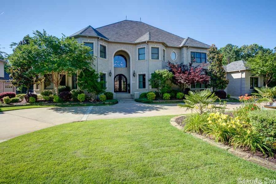 Builders personal luxury showcase- quality and elegance. Gated neighborhood, level lot, circular drive with 2 water features and porte cochere. Cathedral formal living, coiffered ceiling in office, butler's pantry, plantation shutters and Angelfish custom painting. Upgraded chef's kitchen, mud room, granite in laundry and surround sound. Master suite has hardwoods, sitting area, see thru FP and morning coffee bar. Lighted master bath onyx counter tops, unbelievable theater.