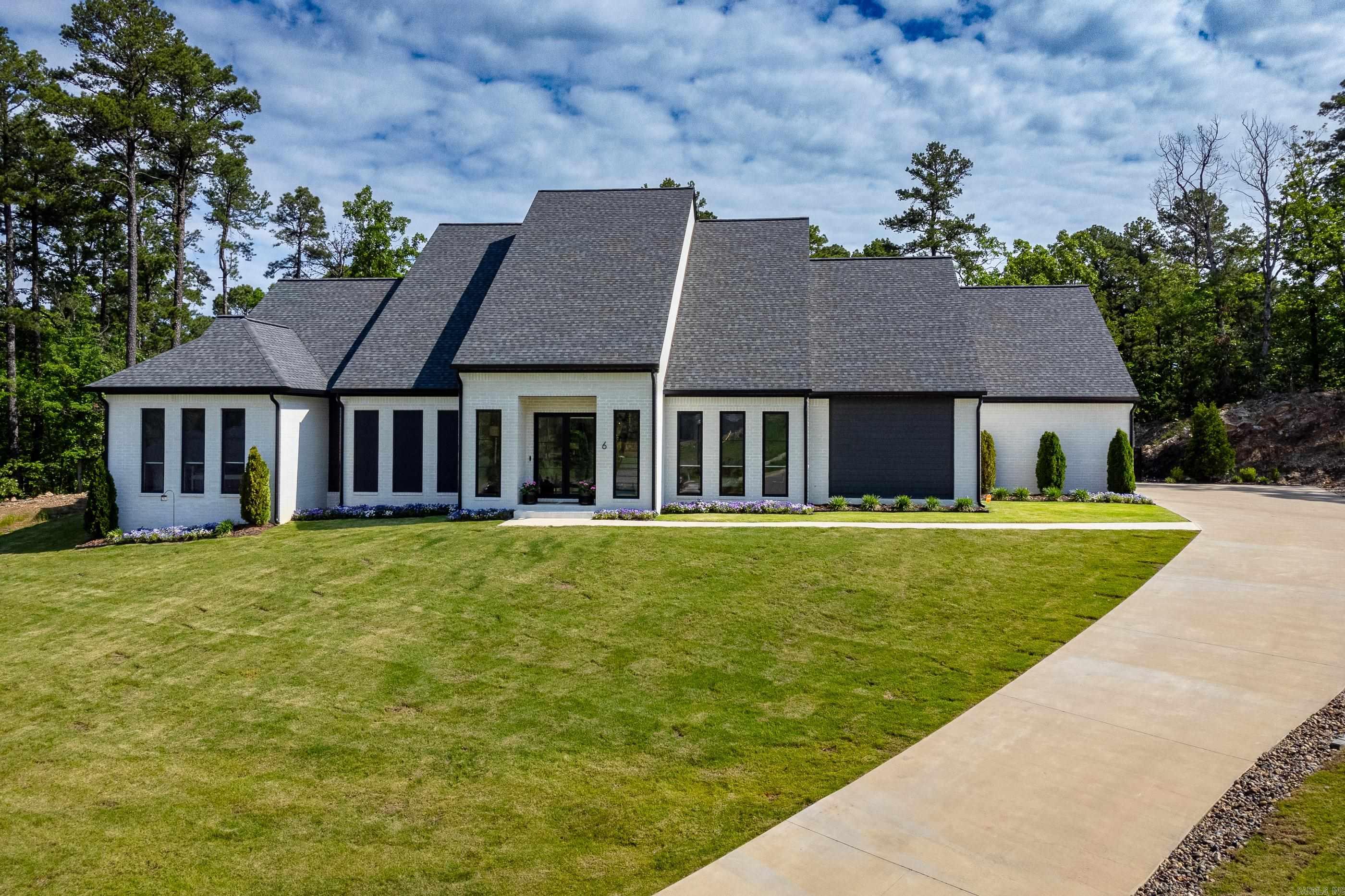 Welcome to the modern luxury of 6 Falstone. Completed in 2022, a wealth of desirable features and custom finishes. 12-foot ceilings on the main floor create a sense of spaciousness throughout. Practical additions like a mudroom and a sizable pantry, with room for an additional refrigerator. The kitchen is a culinary masterpiece, featuring high-end stainless appliances, including a wine refrigerator, ice maker, and Miele coffee maker, catering to the needs of even the most discerning chef. The master suite serves as a sanctuary, offering an office or exercise room, zero-threshold showers, and a generous closet with laundry. Additional guest bedroom downstairs. Home features a tankless hot water system. 1000 square foot three-car oversized garage, equipped with hot and cold water hookups. Upstairs, a bonus area with a second laundry area. Two additional bedrooms complete the upper level, providing comfortable accommodation for family members or guests. Outside, the flat backyard offers complete privacy. The covered back porch, complemented by a half bath and new heaters, extend the entertaining space year-round. * Lot next door can be purchased with home. See Agent remarks.