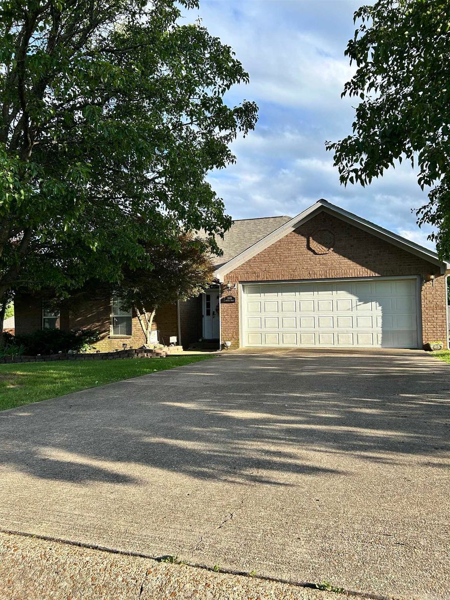 BACK ON THE MARKET !! Lovely four-bedroom two bath brick home tucked away, close to everything, in the Ivanton Addition. As you enter the drive, you will be charmed by the landscaping, including a peach tree in the front, a pear tree in the back, and a beautiful Japanese Maple at the front door—nice large lot with a single gate on one side and a double gate on the other.  Hardwood flooring in the living area. A separate laundry room with a sink and storage space. The primary bedroom has new laminate flooring and a walk-in closet. The primary bathroom features a jetted tub and a walk-in shower. One of the bedrooms is currently being used as an office, featuring a handcrafted large corner desk that will convey.