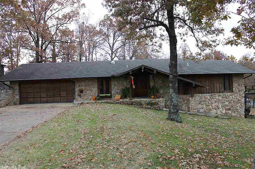 4/2.5 Stone and cypress home with wrap around porch on .1.6 acre (100x310) lot 3900 sqft w finished basement 2 wbfp 3 garages