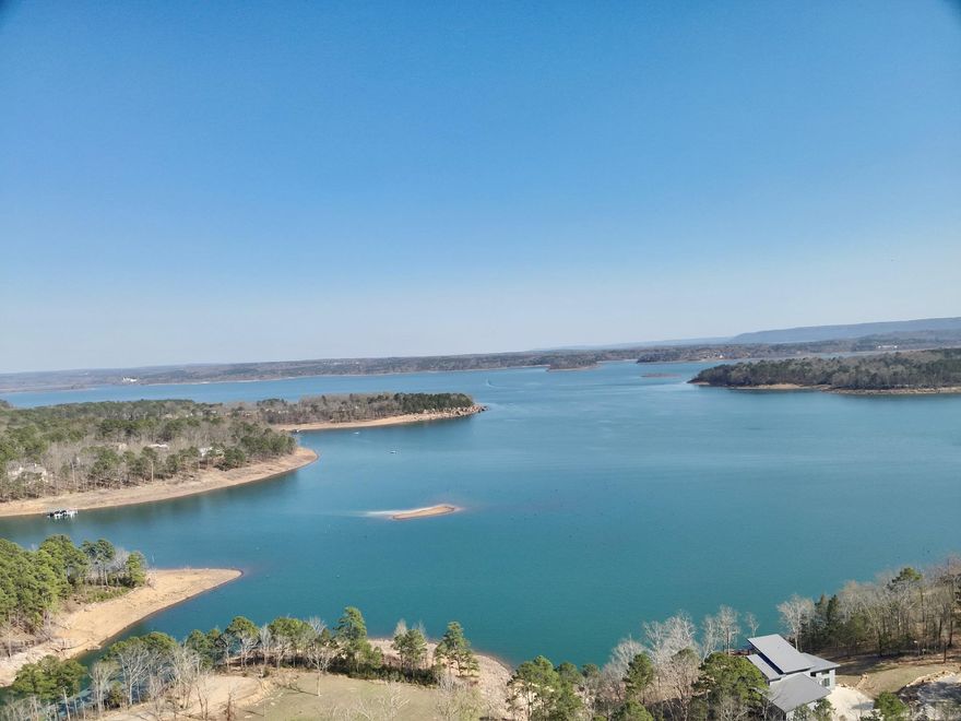 Stunning panoramic views of Greers Ferry Lake and the surrounding Ozark Mountains make this 1.53-acre lot an exceptional opportunity to create the home you’ve always envisioned. With ample space to design and build your ideal lake-area retreat, this property offers both beauty and flexibility in a truly breathtaking setting. A boat slip at Forgotten Peninsula Dock is included, giving you easy access to enjoy one of the most pristine lakes in the United States. The lot also includes a dedicated portion with lakefront access to the beach area, adding even more appeal for relaxing days by the water. Whether you’re planning a full-time residence or a vacation getaway, this spacious lot provides the perfect place to build your dream home. Located in Fairfield Bay, you’ll also enjoy outstanding amenities including two golf courses, pickleball, tennis, ATV/UTV trails, hiking trails, and so much more.