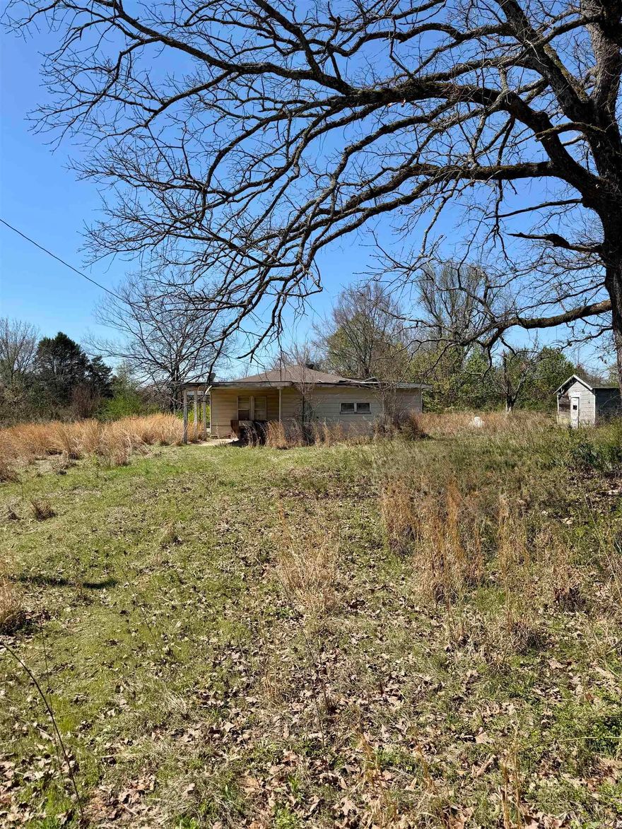 Approximately 1.7 acres ideally located between Interstate 40 and Hwy 352, offering a highly accessible and desirable location. The property features level to gently rolling terrain, making it suitable for a variety of uses.  An older home is present on the property given no value. Utilities include Arkansas Valley Electric on site, an active Horsehead Water meter, and a septic system believed to be present (type and condition unknown).  The property also offers highway frontage on Hwy 352, enhancing accessibility and visibility.