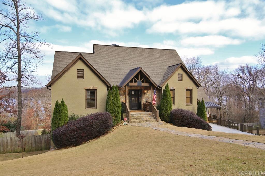 Architect Designed custom built tome with In-Law Quarters (2700sf) w/separate entrance. High vaulted ceilings, game room, exercise room, play room, office, 2 car garage and extra 1 car garage. Swimming pool with extensive decking. Gated neighborhood. 2 Kitchens. View of Arkansas River and Pinnacle Mtn. with easy access to river bike trail and Big Dam Bridge. Extensive decking for entertaining and enjoying the views. See Agent Remarks for exclusions.