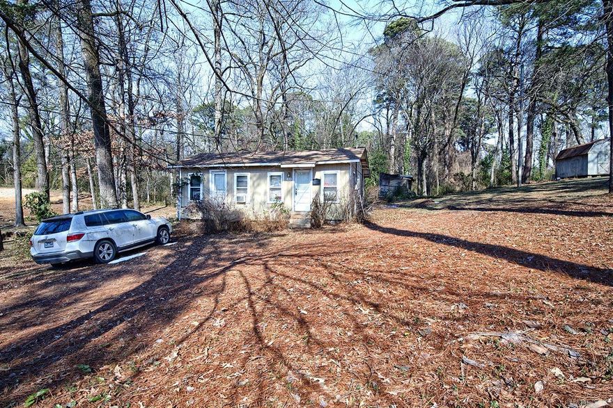 Exceptional opportunity to acquire a .60 acre lot in a highly desirable Benton location, just a short walk to Elementary through high school campuses.  This oversized parcel offers excellent potential for redevelopment, expansion, or a custom build in an established area.  This property includes an existing structure that is uninhabitable and will need to be removed, marking this a true land-value offering.  Selling As-Is. No property disclosures. This property is also listed with 602 East Sevier as a package