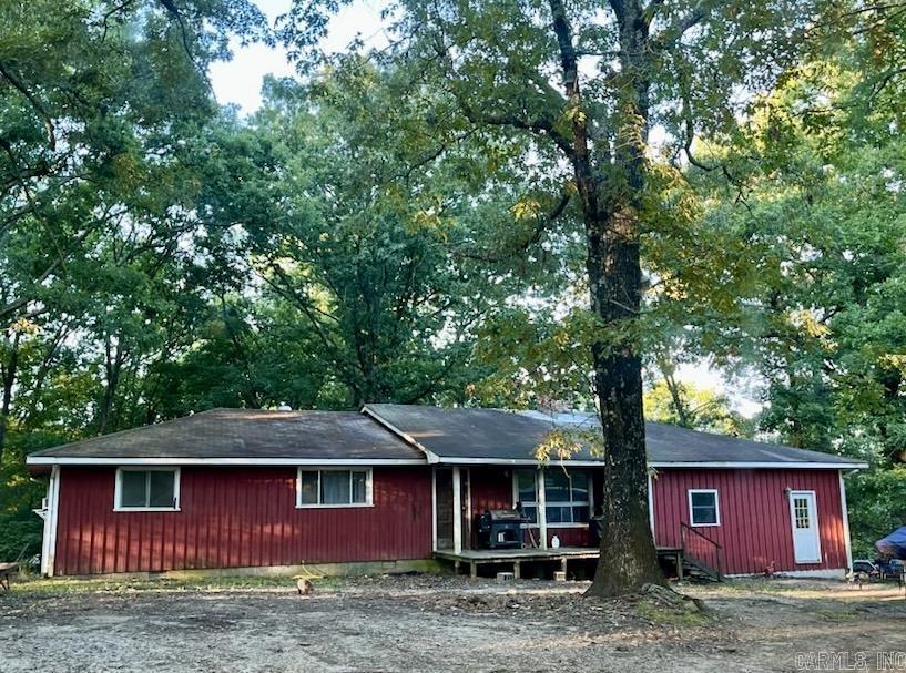 Tucked away on Iron Mountain, just a few miles south of Mena, this 3 bed, 2 bath home offers 2,168 sq ft of living space and the best of both worlds—close to town for convenience, yet far enough for country living. Sitting on 8± acres with a pond and access to Wolf Pen Gap, this home is a blank canvas, ready for your personal touch.
