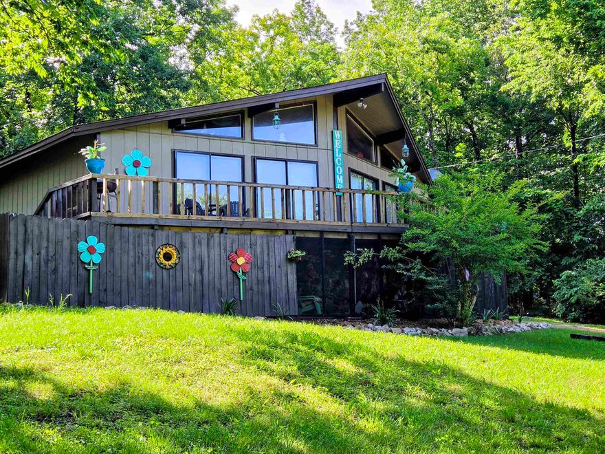 Lake Thunderbird Lake View home! Deck spans the front of the home so you can enjoy the view of the lake or the wildlife from the extra lot next door included. Inside there is plenty of natural light from all the windows and doors out to the deck. Wood ceilings in main part of the home and vaulted in the living room. Custom light fixtures in most rooms stay or make it your own. Split floor plan with 1 bedroom and bath on one side with 2 others and 2nd bath on the other. Sliding glass doors from 2 front bedrooms and living room. Central heat updated in 2019 & gas back up heater avail if power goes out. Back deck leads to small fenced area for dogs plus cat door to catio off the laundry rm. Entry from the carport has tons of storage plus space available for freezer or even an office space. Kitchen includes 2 fridges (one blends right in with the cabinets), electric stove and breakfast bar for a quick bite. Updates include fresh paint inside and out, new laminate flooring, water heater, asphalt shingles 2024, new kitchen sink & bath vanities. 16X8 Bald Eagle Barn for all your outside toys. Screened in under the front deck to enjoy outside but not the bugs! Listed below appraisal price!