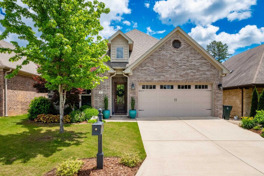 Welcome to 1 Creekwood Court!  This 4 bed/3bath home is located in the highly sought-after Wildwood area of West Little Rock.  This thoughtfully designed home features 2 bedrooms and 2 full bathroom downstairs, one being the luxurious primary suite. The spacious kitchen boasts granite countertops, a large island, and a natural gas range, perfect for cooking enthusiasts. A gas fireplace adds coziness to the living area, while the built-in speaker system extends entertainment options to the living room and covered back patio.  Upstairs you will find a versatile landing area, ideal as a playroom, lounge, or extra living space for the 2 guest rooms on each side. Storage is abundant with a large walk-in attic, providing an additional 400sqft of storage space for seasonal items and household essentials. Outside you will enjoy privacy and serenity with a fenced backyard that backs up to protected green space.  This warm and receptive subdivision has a neighborhood park, playground, and swimming pool!  Come experience community, convenience, and luxury all in one stunning property!