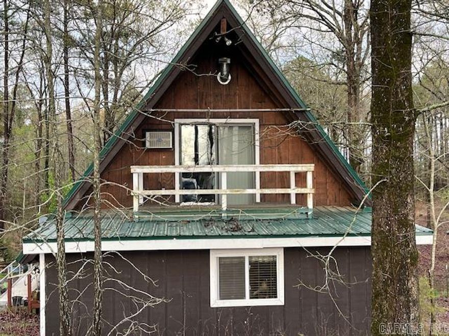 Beautiful home on 13 wooded acres with a guest house & stocked pond very near Lake Greeson.