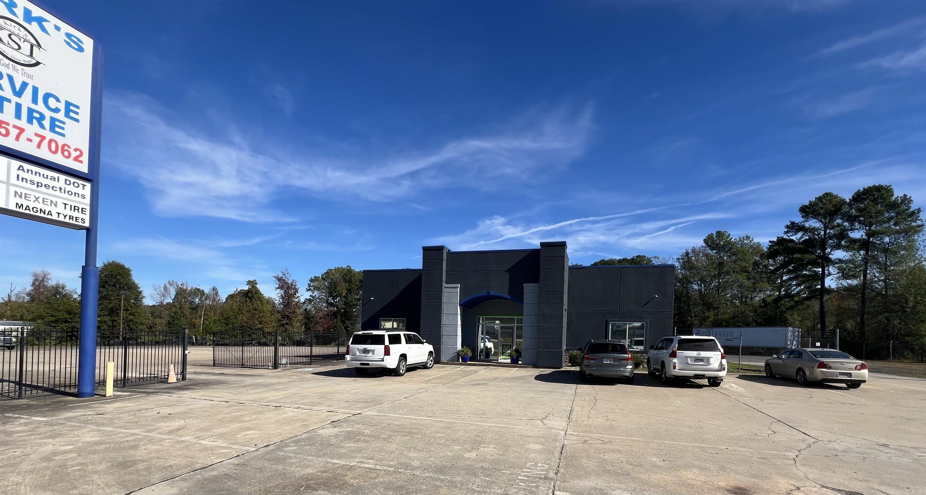Fabulous location off Interstate 57/ US HWY 67/167. Endless Business Opportunities. Beautiful stucco and stone storefront with large showroom and repair shop with 6 bay doors that can accomodate 18 wheeler service repair. 1200 sq ft Showroom boasts 2 executive offices, separate restrooms, storage area and new paint inside and out. Repair shop has great lighting and plenty of storage for any business endeavor. Excellent business visibility from Interstate 57, a large fenced concrete area and the beautifully updated building make this property a must see.