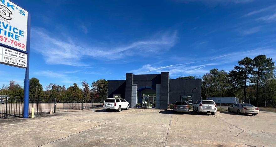 Fabulous location off Interstate 57/ US HWY 67/167. Endless Business Opportunities.  Beautiful stucco and stone storefront with large showroom and repair shop with 6 bay doors that can accomodate 18 wheeler service repair. 1200 sq ft Showroom boasts 2 executive offices, separate restrooms, storage area and new paint inside and out.  Repair shop has great lighting and plenty of storage for any business endeavor.  Excellent business visibility from Interstate 57, a large fenced concrete area and the beautifully updated building make this property a must see.