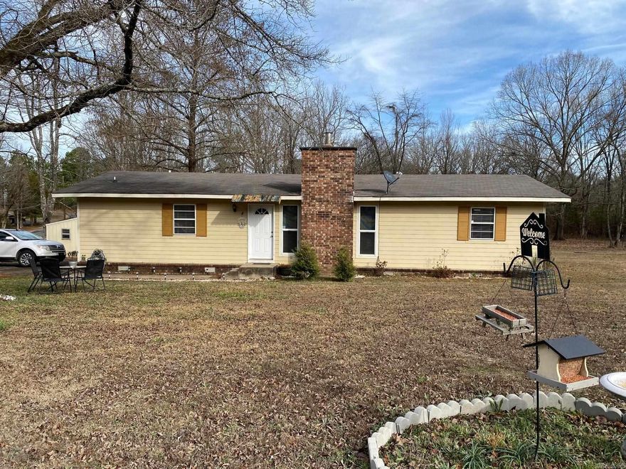 If you like the idea of having a place to garden, pick fruit, raise chickens, a fenced in area for your dogs, storage shed on three acres and be right outside of town, this is the place for you.  This great home is 2 bed/2 bath and has an extra room that can be used as a large den or a game room, has a large kitchen with new appliances, and a gas fireplace.  Check it out soon!!!!